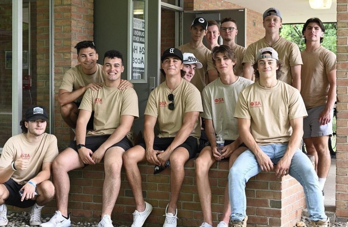 Alpha Sigma pictured together helping freshman on move-in day
