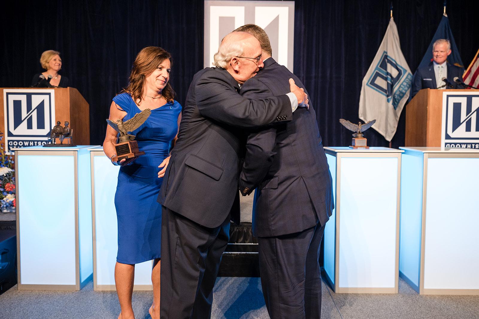 President Kent MacDonald hugging a Wings of Freedom honoree