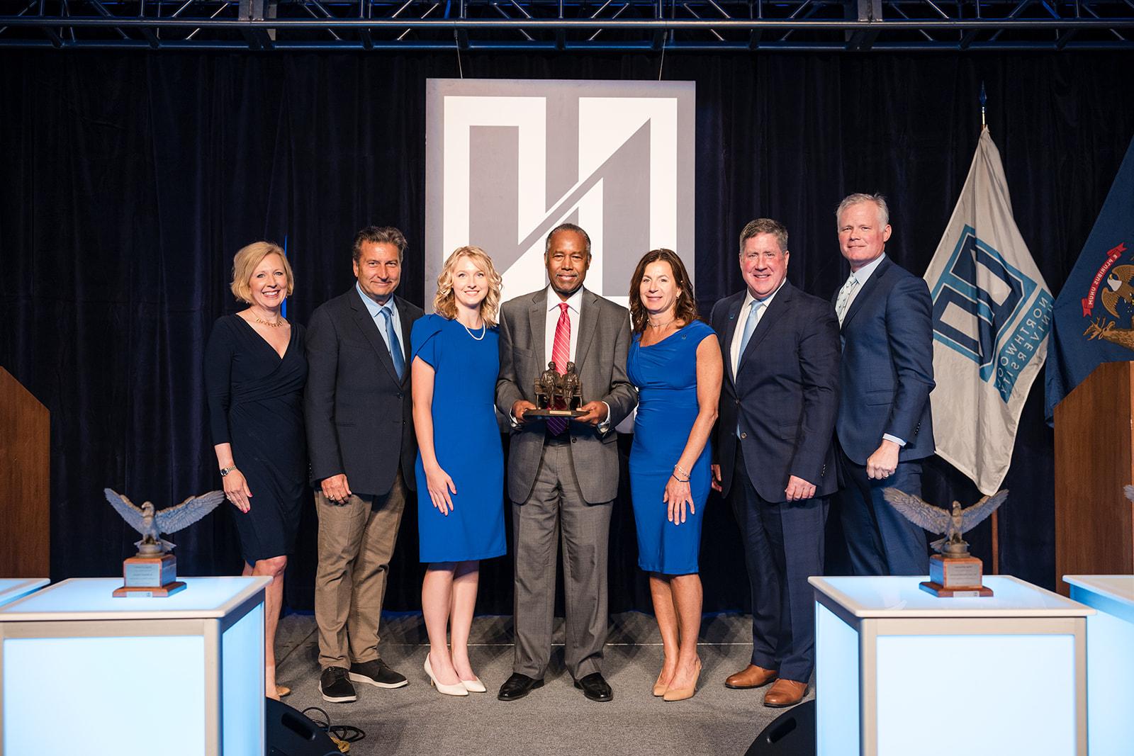 Dr. Benjamin Carson accepting a Wings of Freedom award from the Executive Team at Northwood University